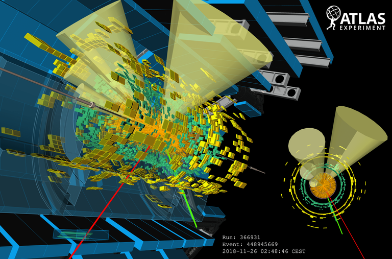 Display of a lead–lead collision at 5.02 TeV per nucleon pair that resulted in a candidate pair of top quarks that decay into other particles. Display of a lead–lead collision at 5.02 TeV per nucleon pair that resulted in a candidate pair of top quarks that decay into other particles.